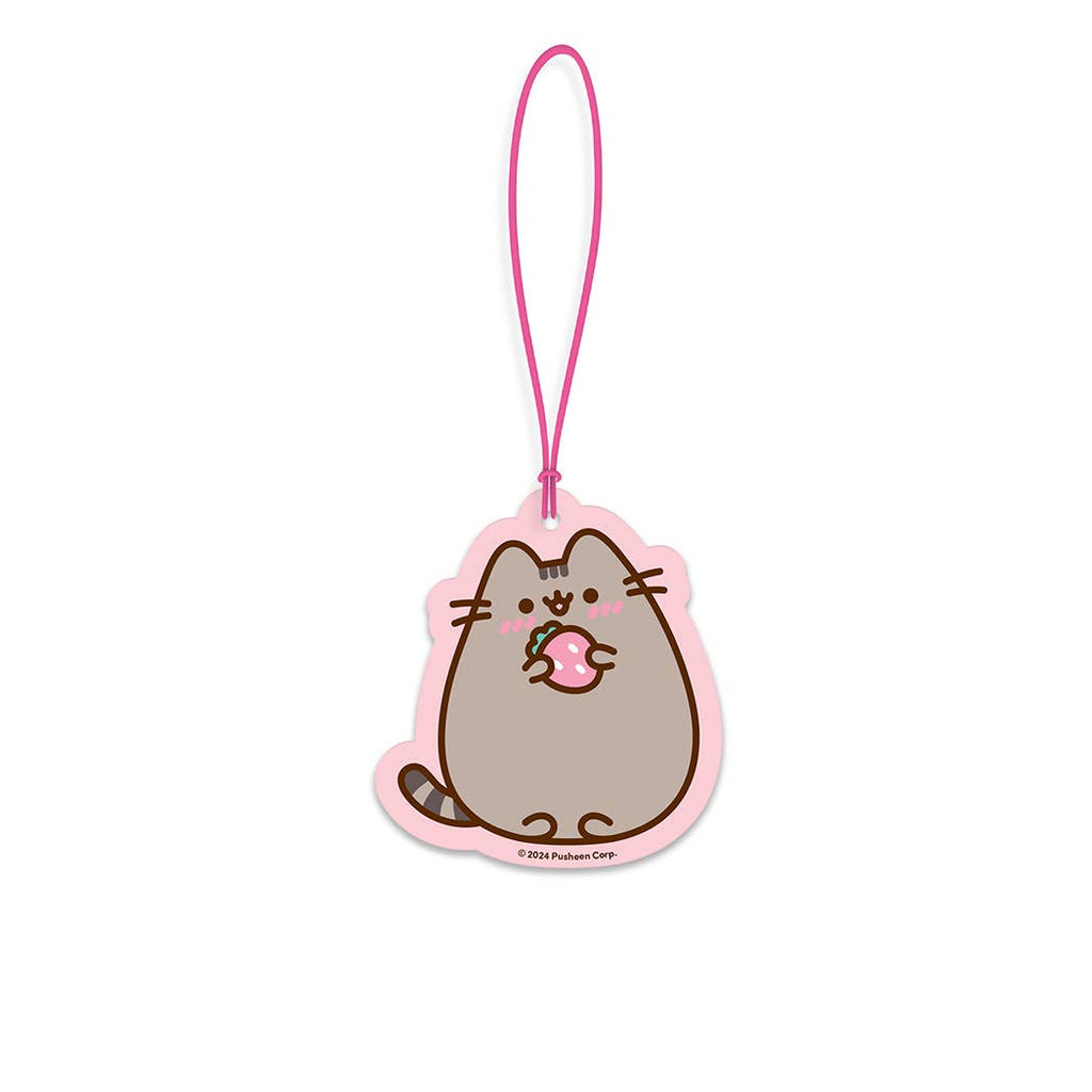 Cartoon cat character car freshener on a pink strap with a white background