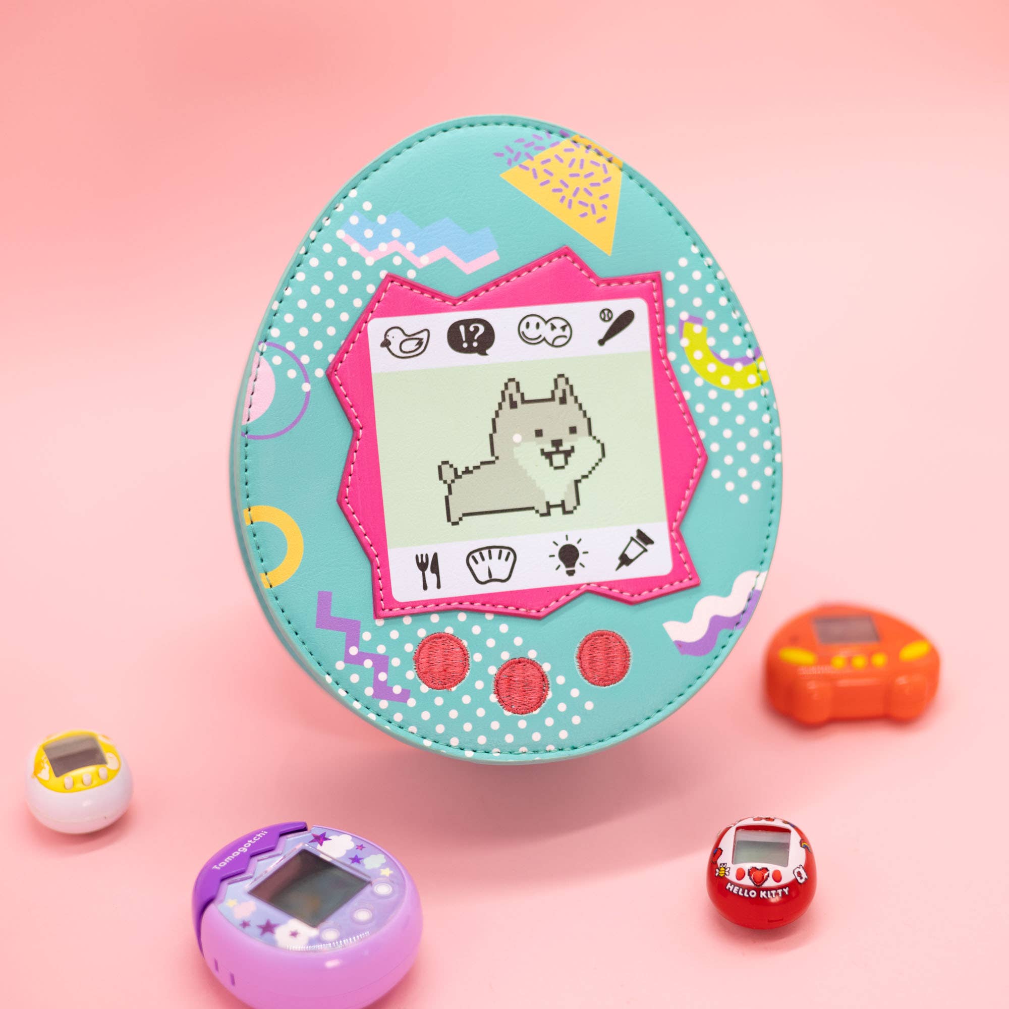 Blue virtual pet crossbody bag with a dog on it with a pink background