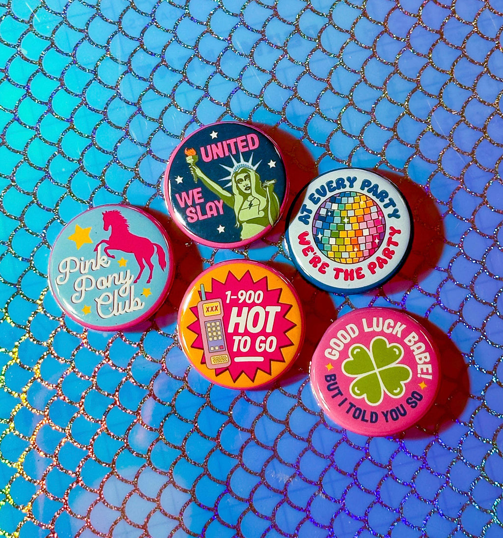 Set of colorful buttons with various designs on a blue textured background
