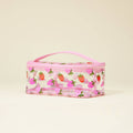 Pink cosmetic bag with strawberry pattern on a beige background