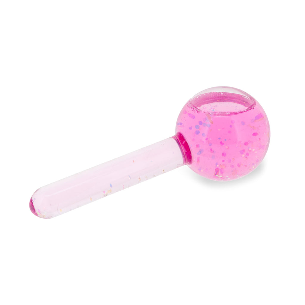 Pink facial ice globe with glitter inside against a white background
