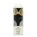 Minnie Mouse hair brush packaging with gold bow design on a white background