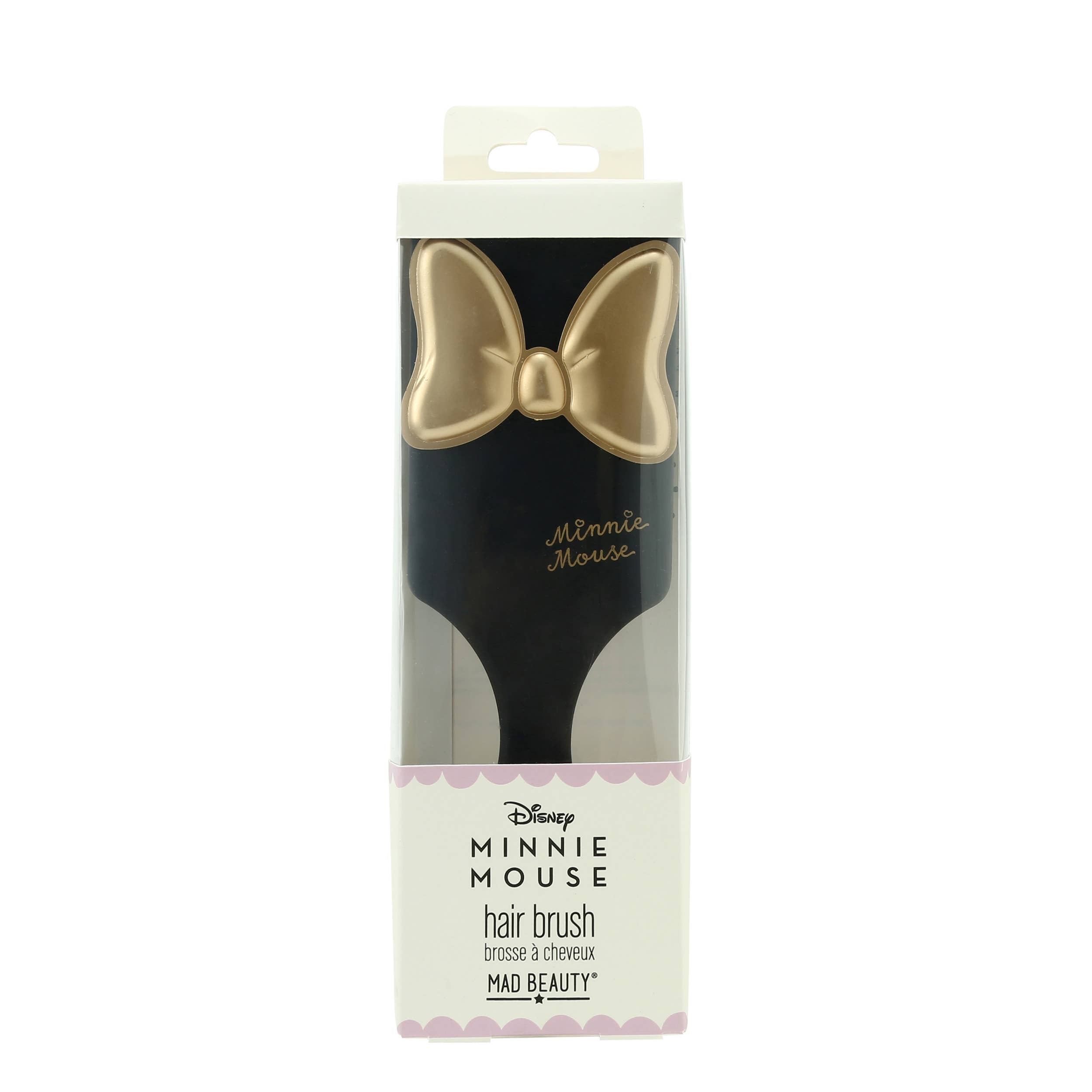 Minnie Mouse hair brush packaging with gold bow design on a white background