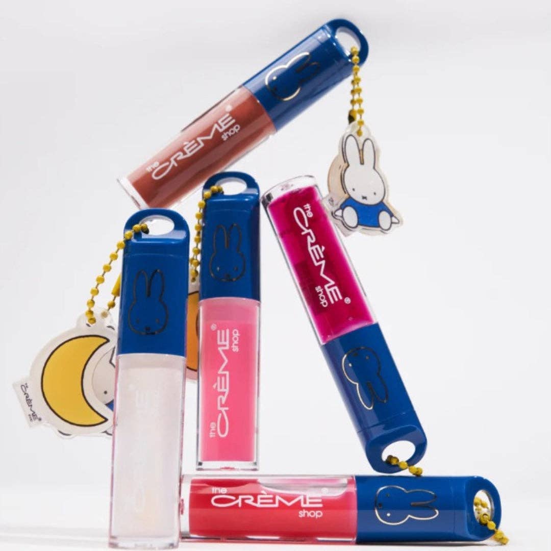 Lip oils with keychains on a white background