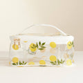 Clear cosmetic bag with lemon pattern on a beige background
