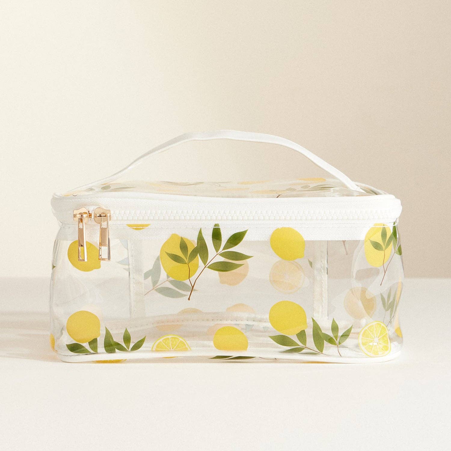 Clear cosmetic bag with lemon pattern on a beige background