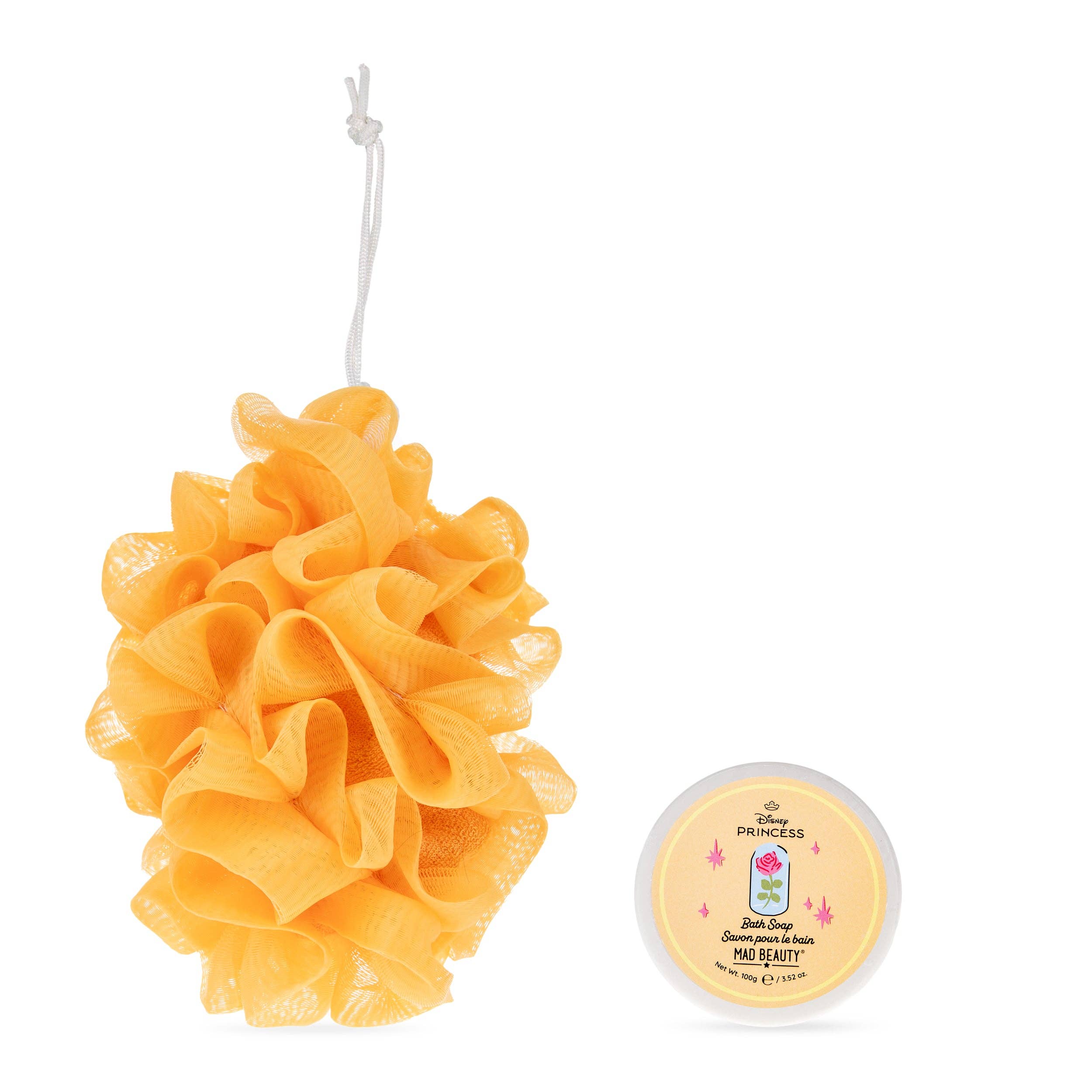 Yellow bath pouf and a small container of soap on a white background