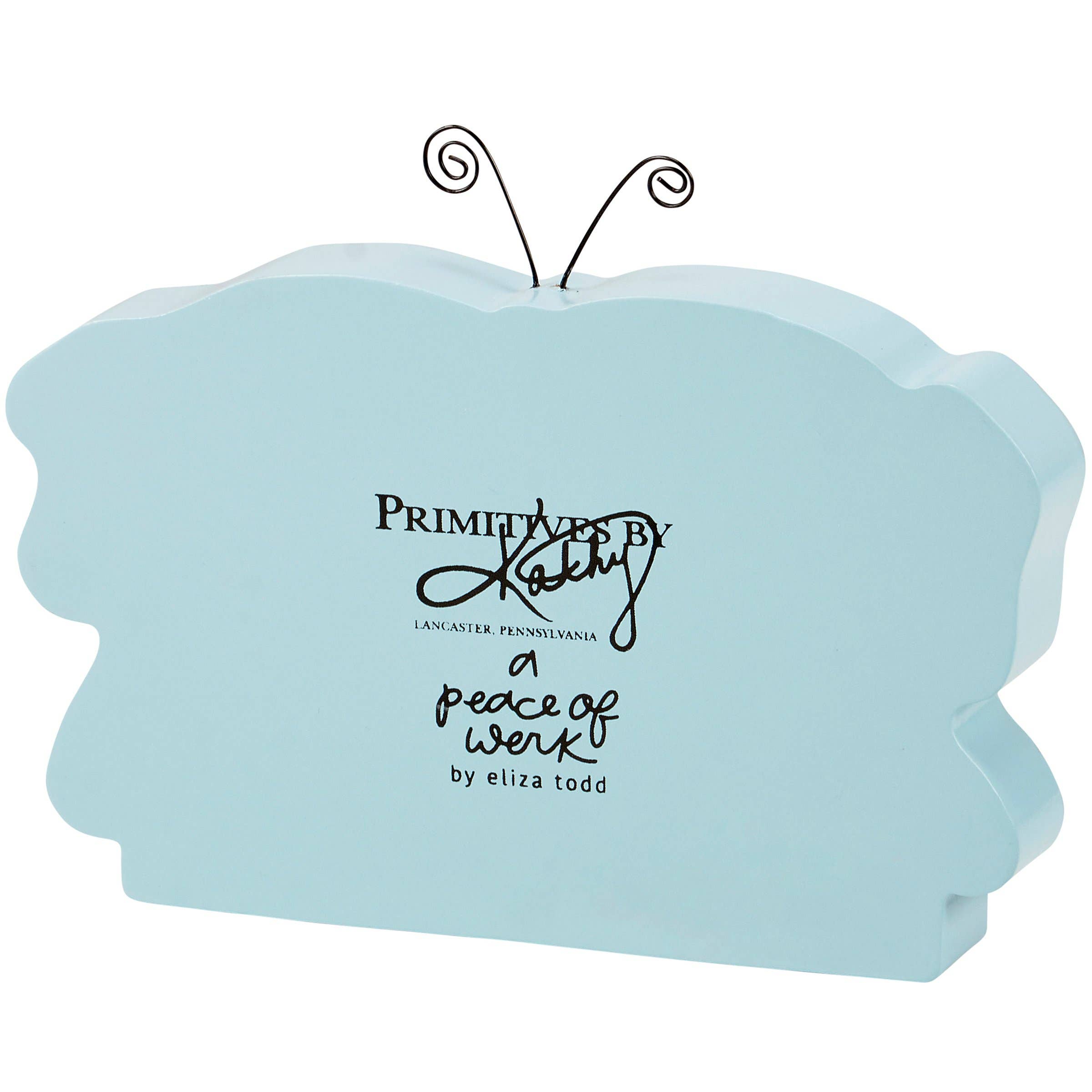 Light blue butterfly-shaped block with text on a white background