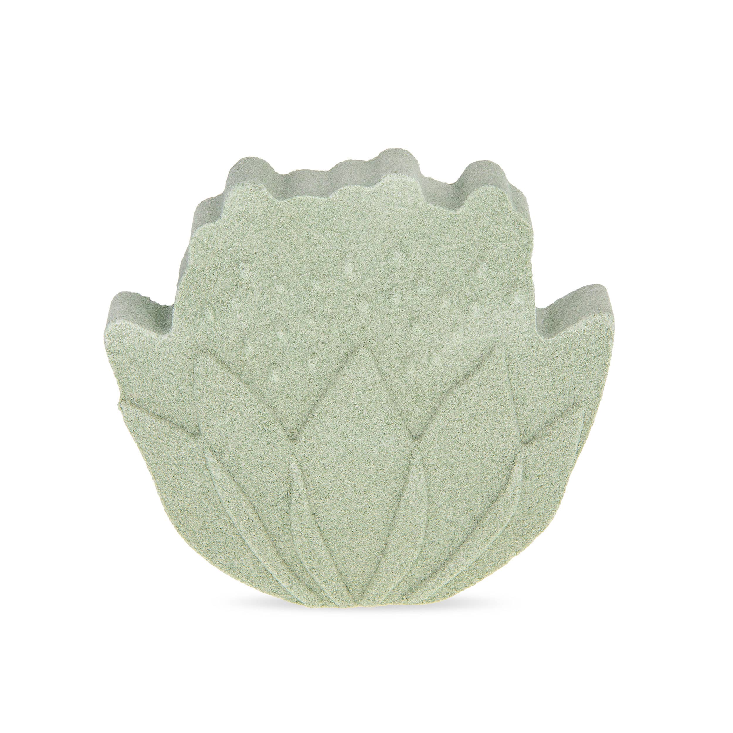 Green leaf-shaped bath bomb on a white background