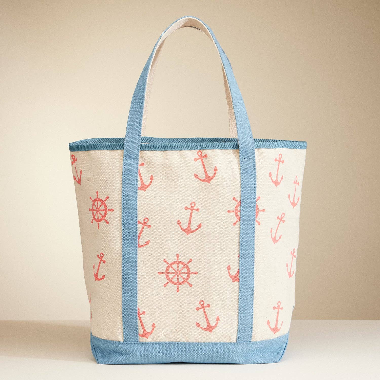 Tote bag with anchor and wheel pattern on a beige background