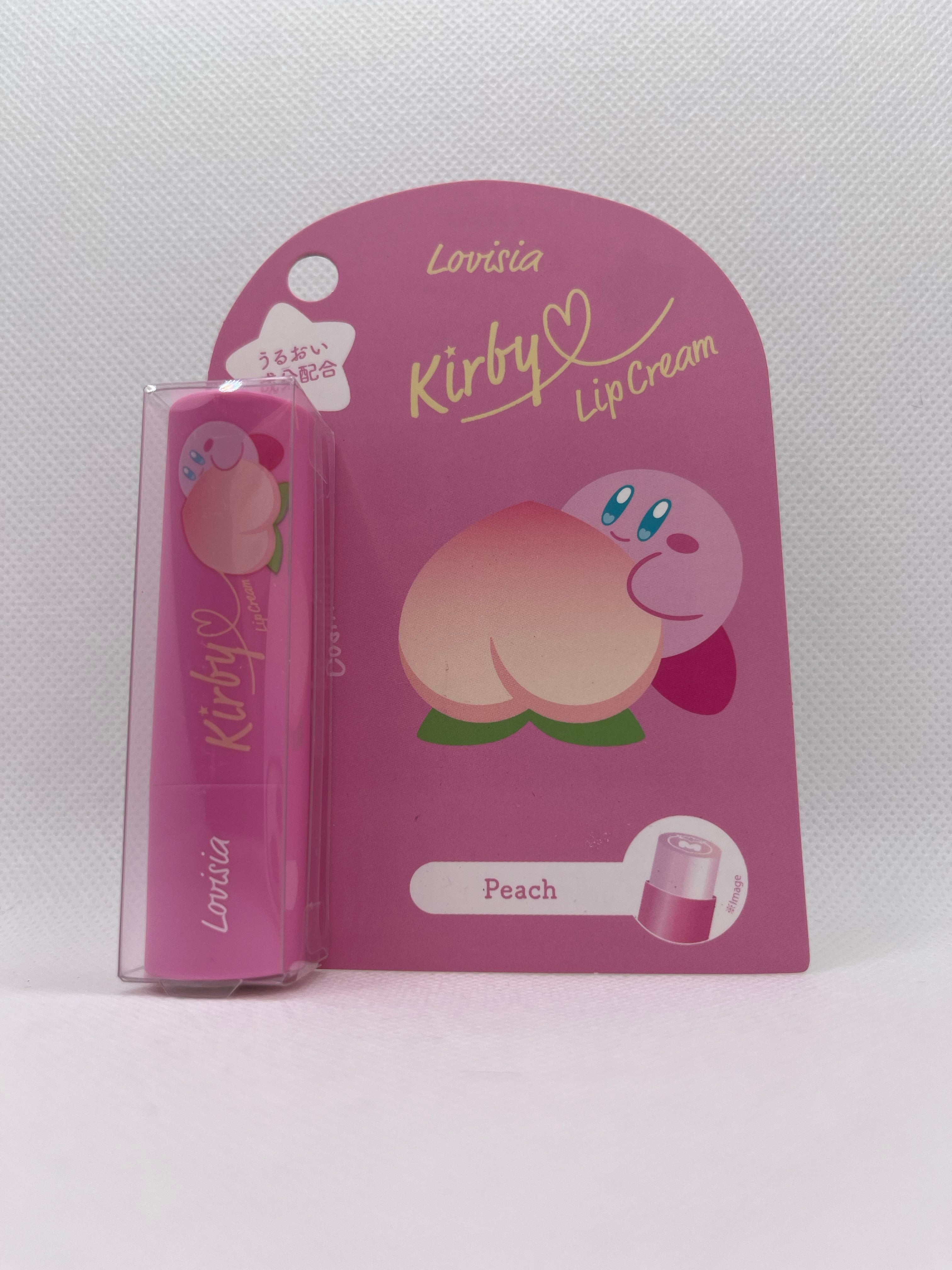 Kirby lip balm in pink packaging against a white background