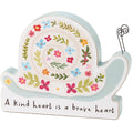 Decorative snail-shaped sign with floral design and motivational quote on a white background
