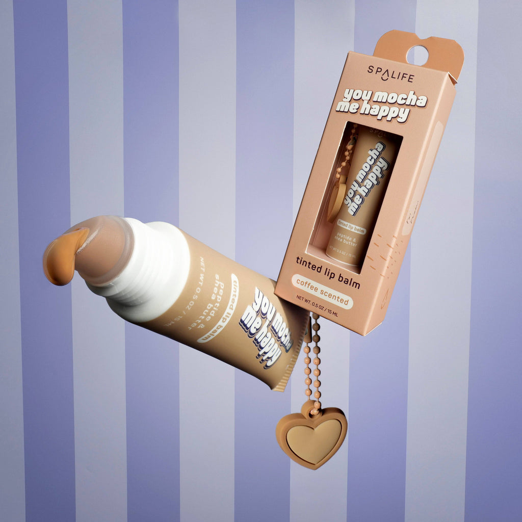 Tinted lip balm with packaging on a striped background