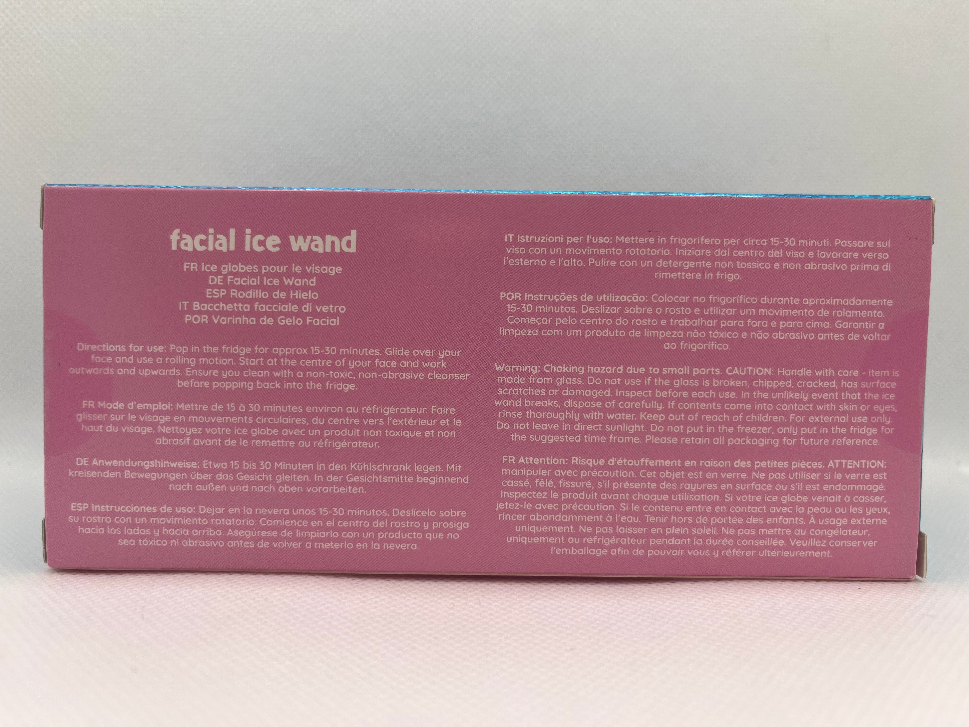 Pink facial ice wand box with text against a white background