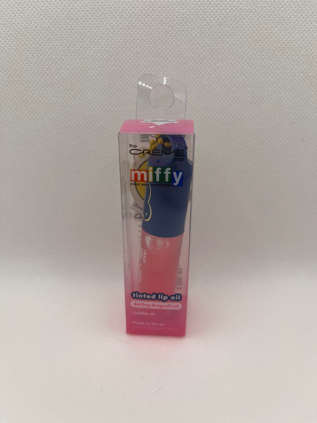 Pink Miffy lip oil on a white background