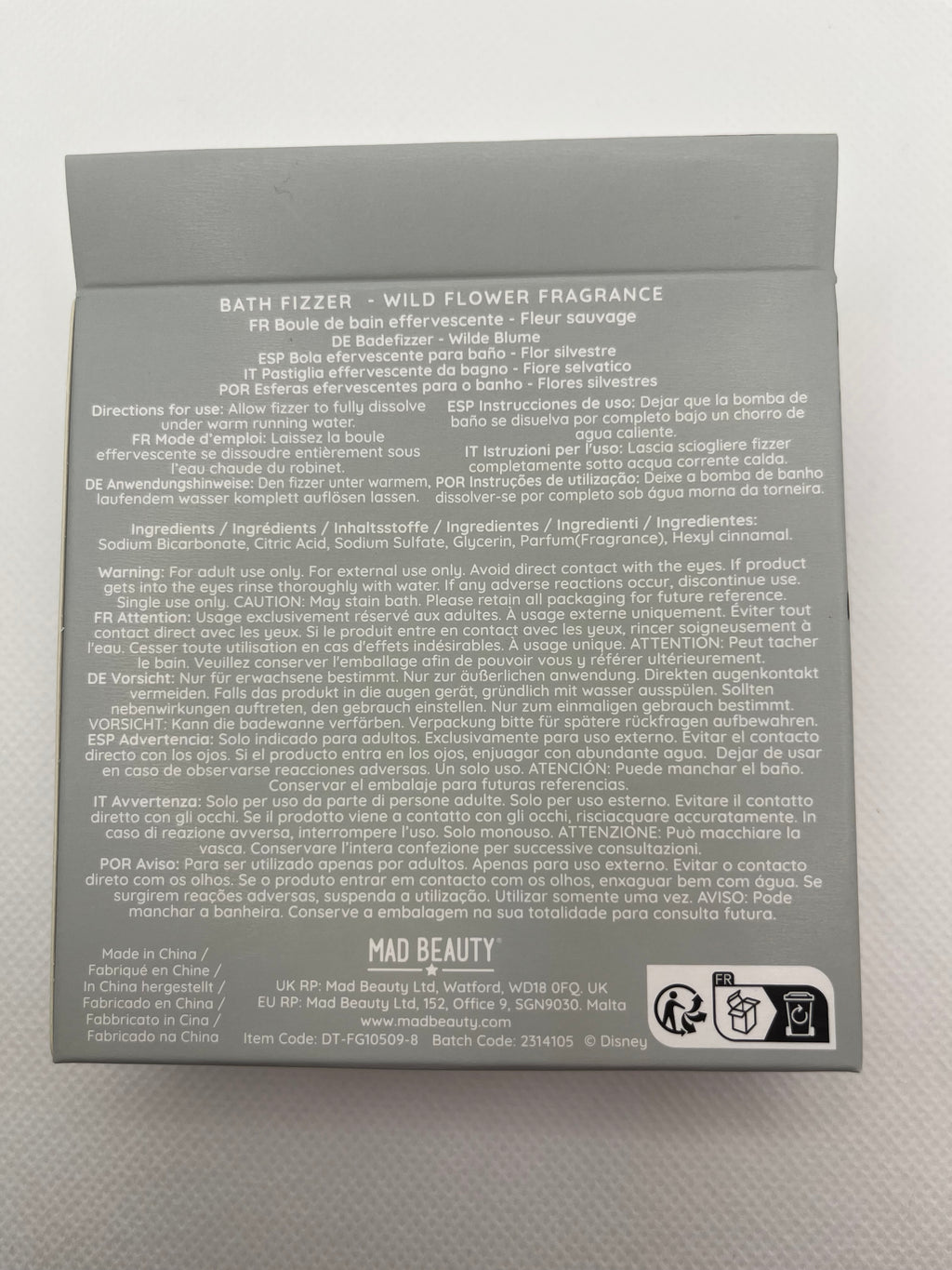 White bath bomb in gray packaging on a white background