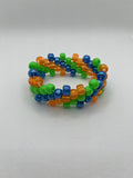 Orange, blue, and green spiral small beaded cuff bracelet against a white background