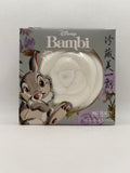 White bath bomb in gray packaging on a white background