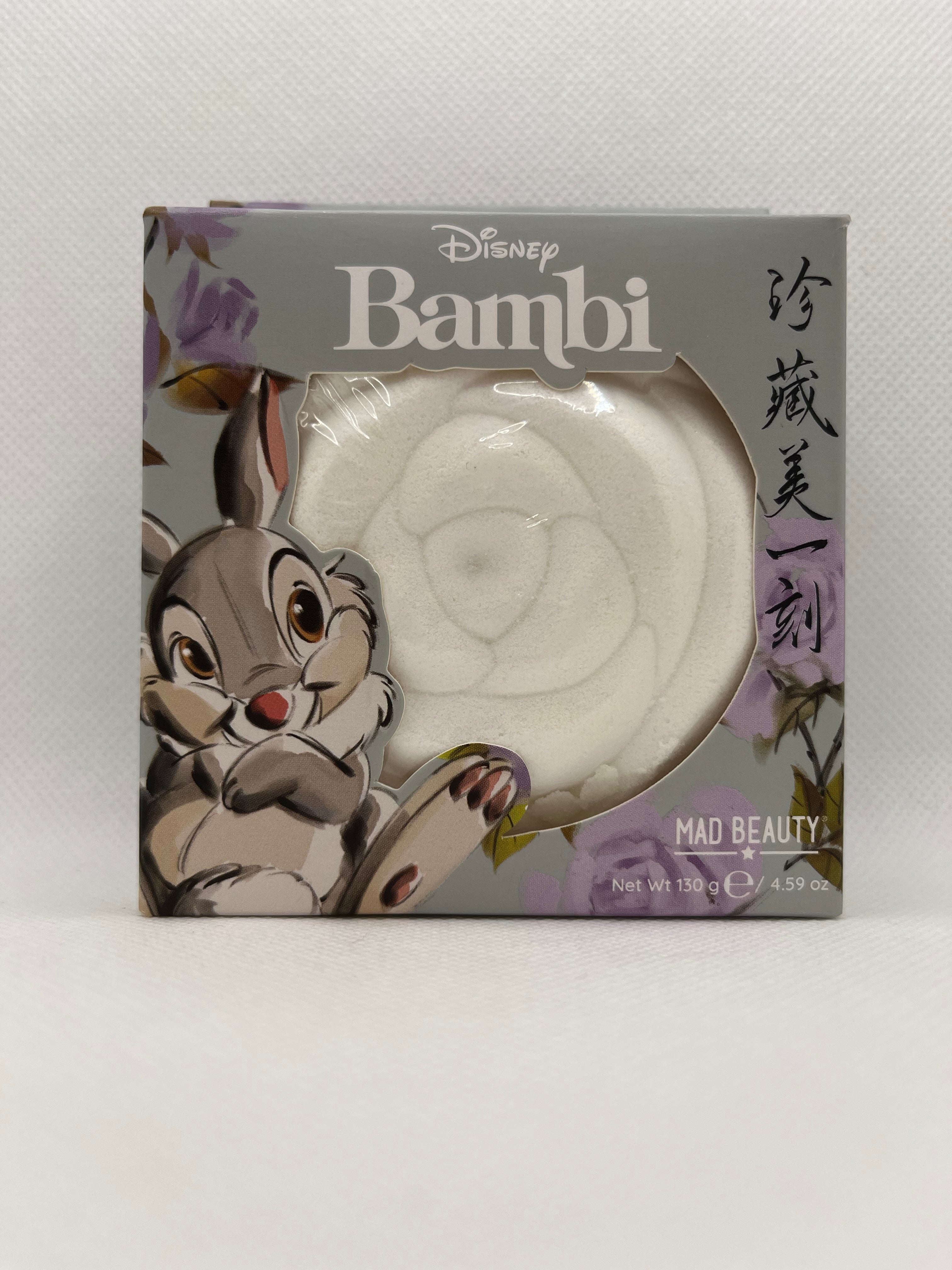 White bath bomb in gray packaging on a white background