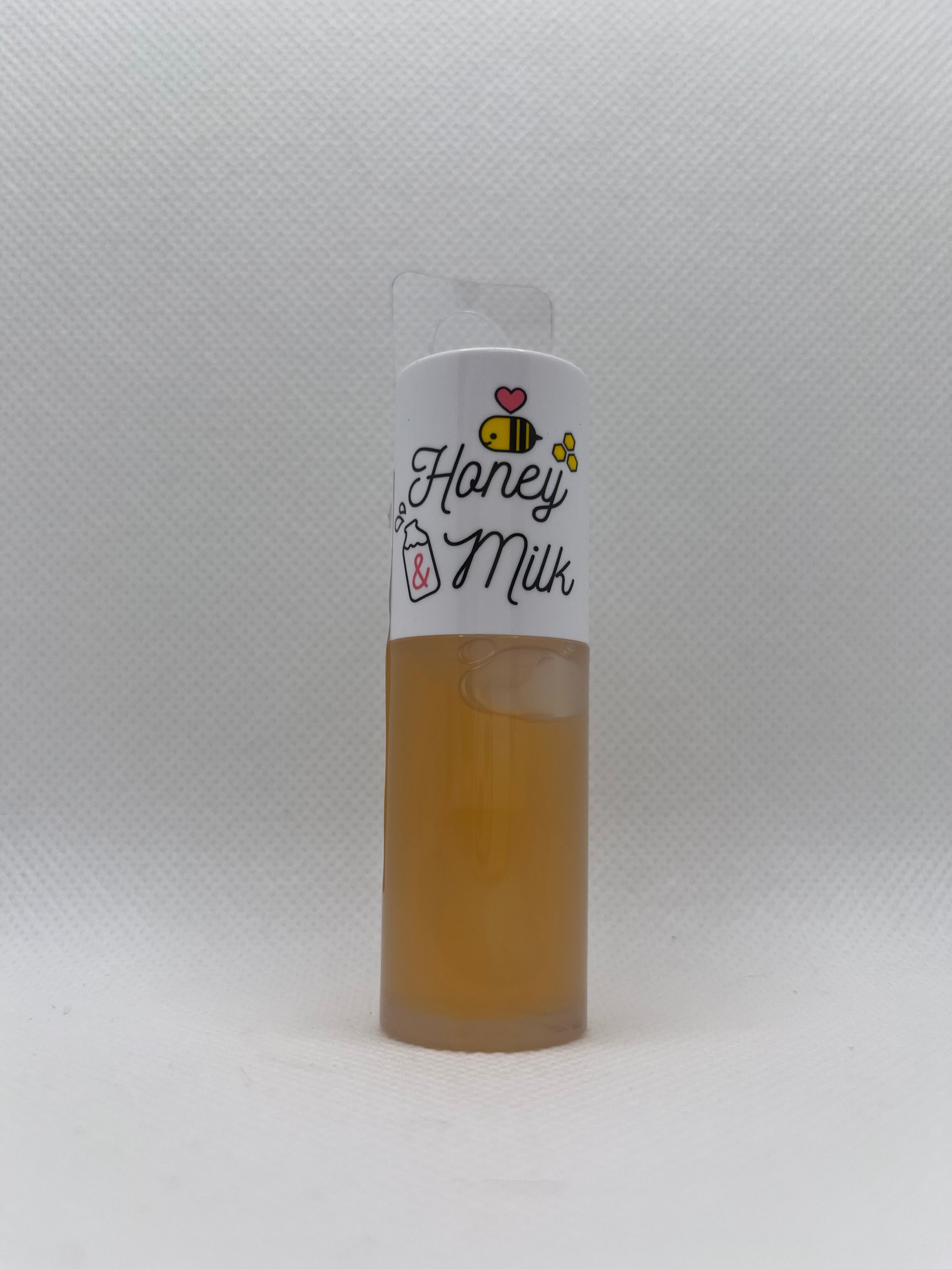 Small lip oil labeled 'Honey Milk' on a white background