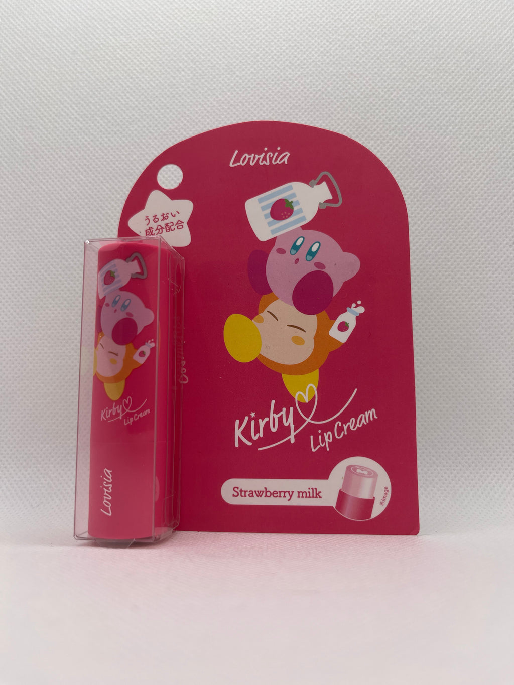 Pink Kirby lip balm packaging against a white background
