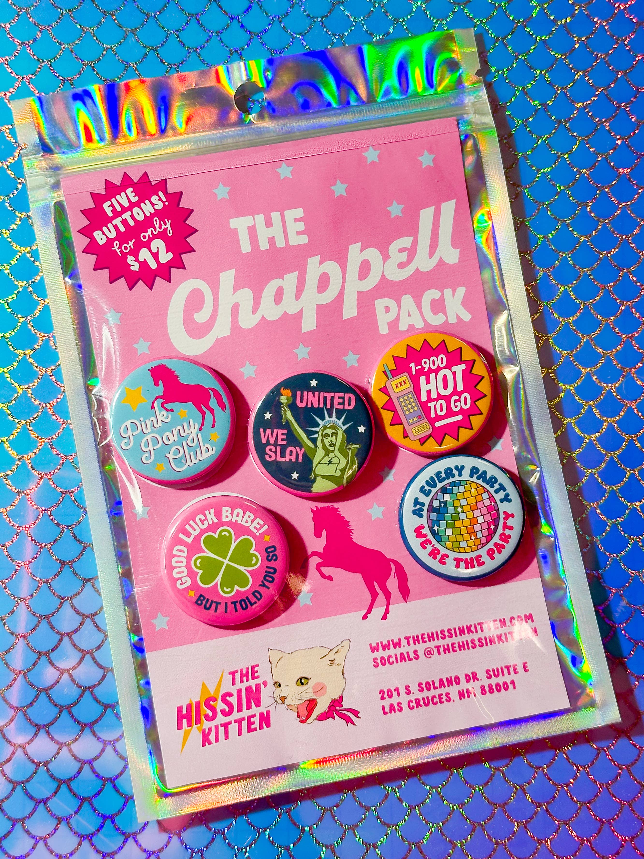 Packaged product labeled 'The Chappell Pack' with colorful buttons on a blue and gold patterned background.