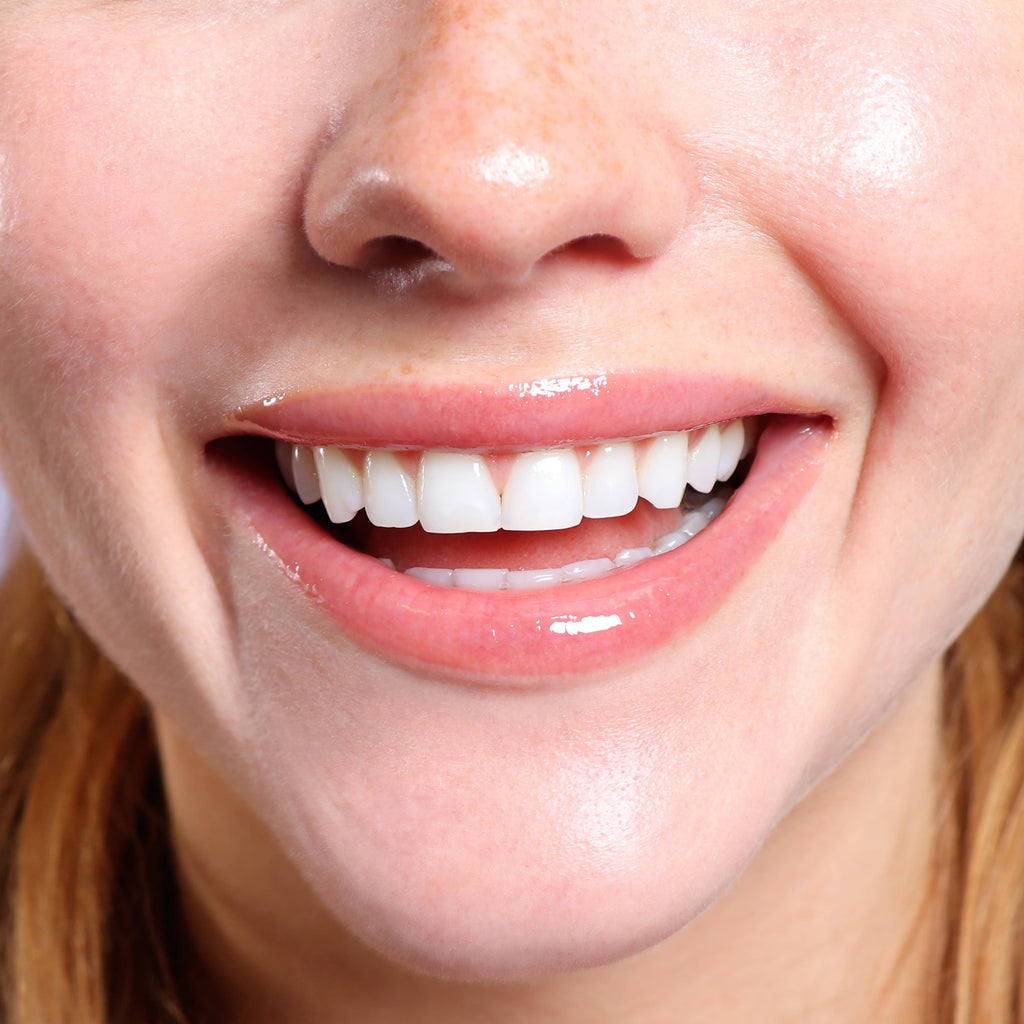 Close-up of a person's mouth with tinted lip balm applied