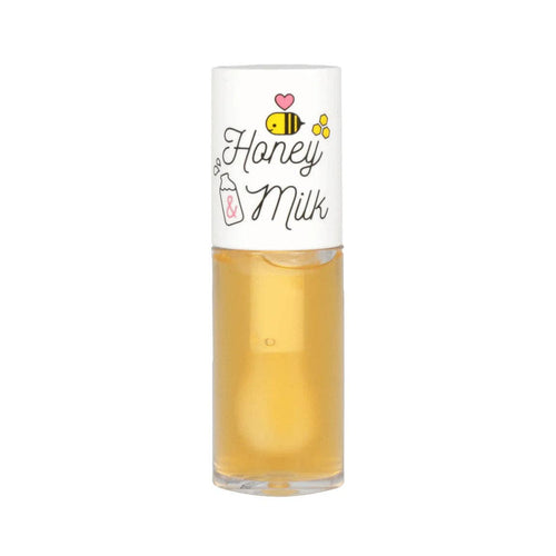 Yellow honey milk lip oil against a white background