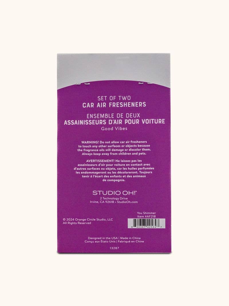 Back of a car air freshener packaging with purple and white design.