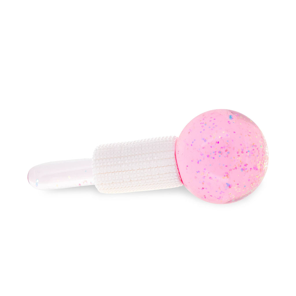 Pink glittery ice globe with a white handle on a white background