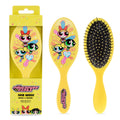 Yellow hairbrush with Powerpuff Girls design and packaging on a white background