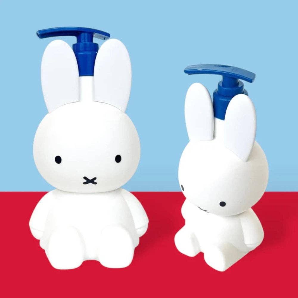 Two white rabbit-shaped bottles with blue pumps on a red and blue background