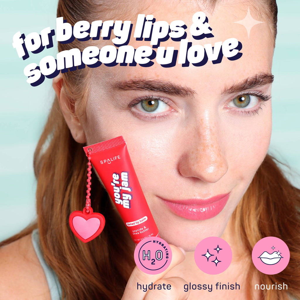 Woman holding a lip balm with text 'for berry lips & someone u love' on a light blue background