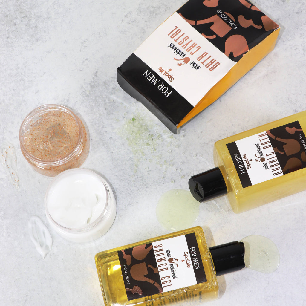 Men's grooming products including bottles and a jar on a textured surface.