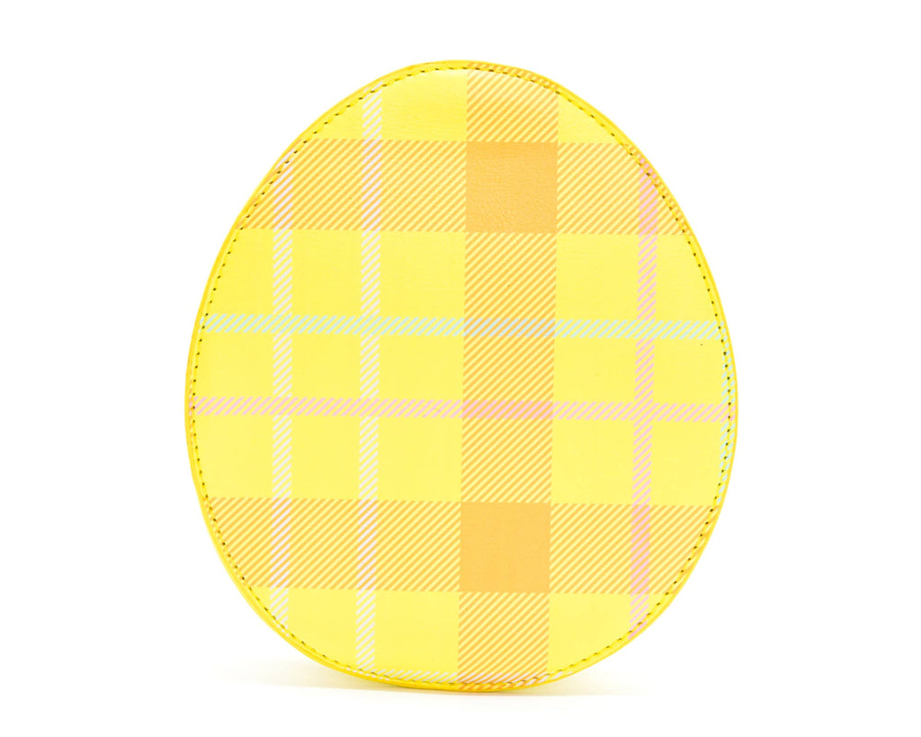 The back of a yellow crossbody bag against a white background